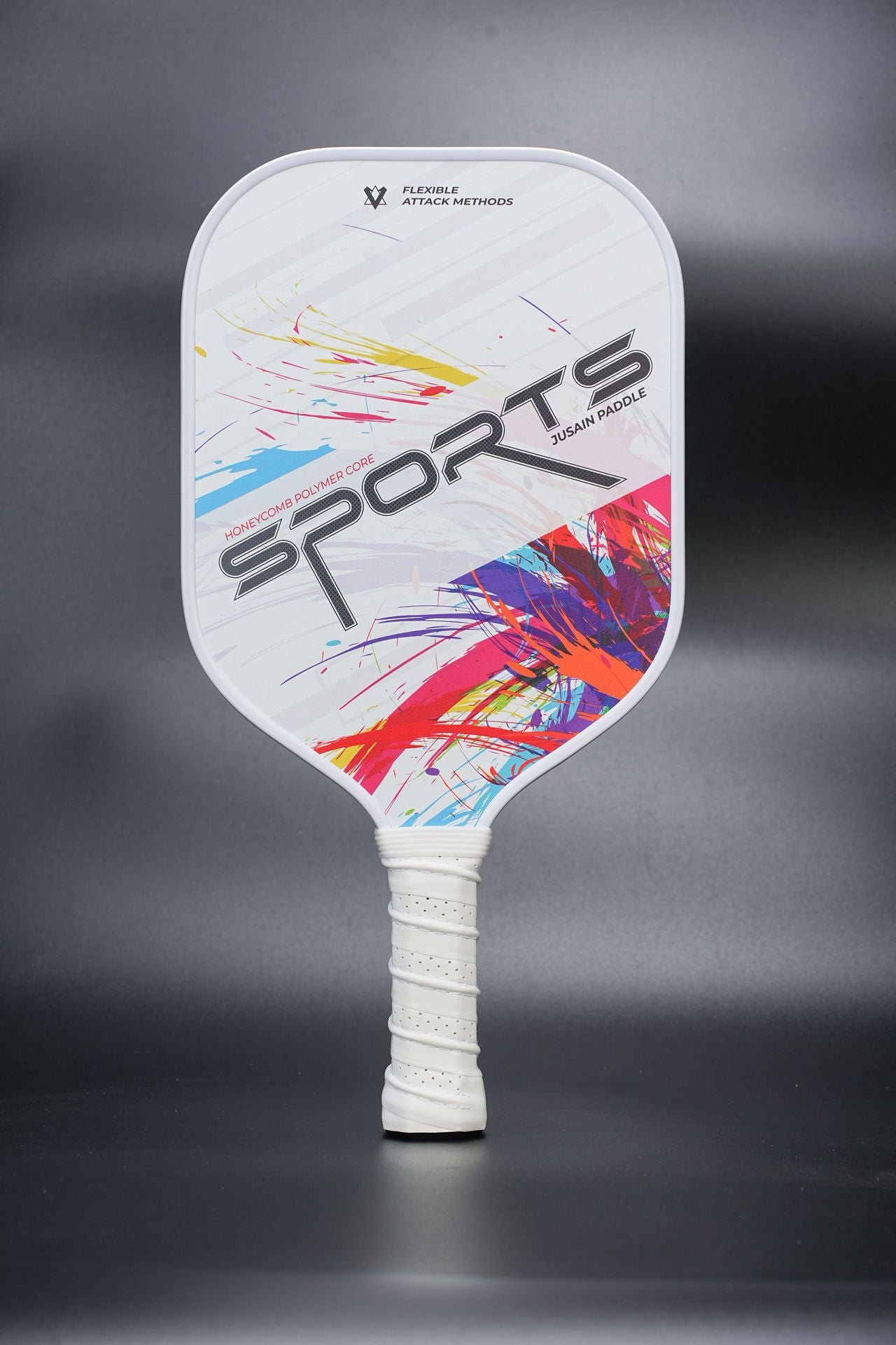 Xephira 16mm defensive paddle on a white background with colorful abstract brush splatters and large "SPORTS" text. Highly appealing to stylish sports enthusiasts asking where can i buy pickleball paddles.