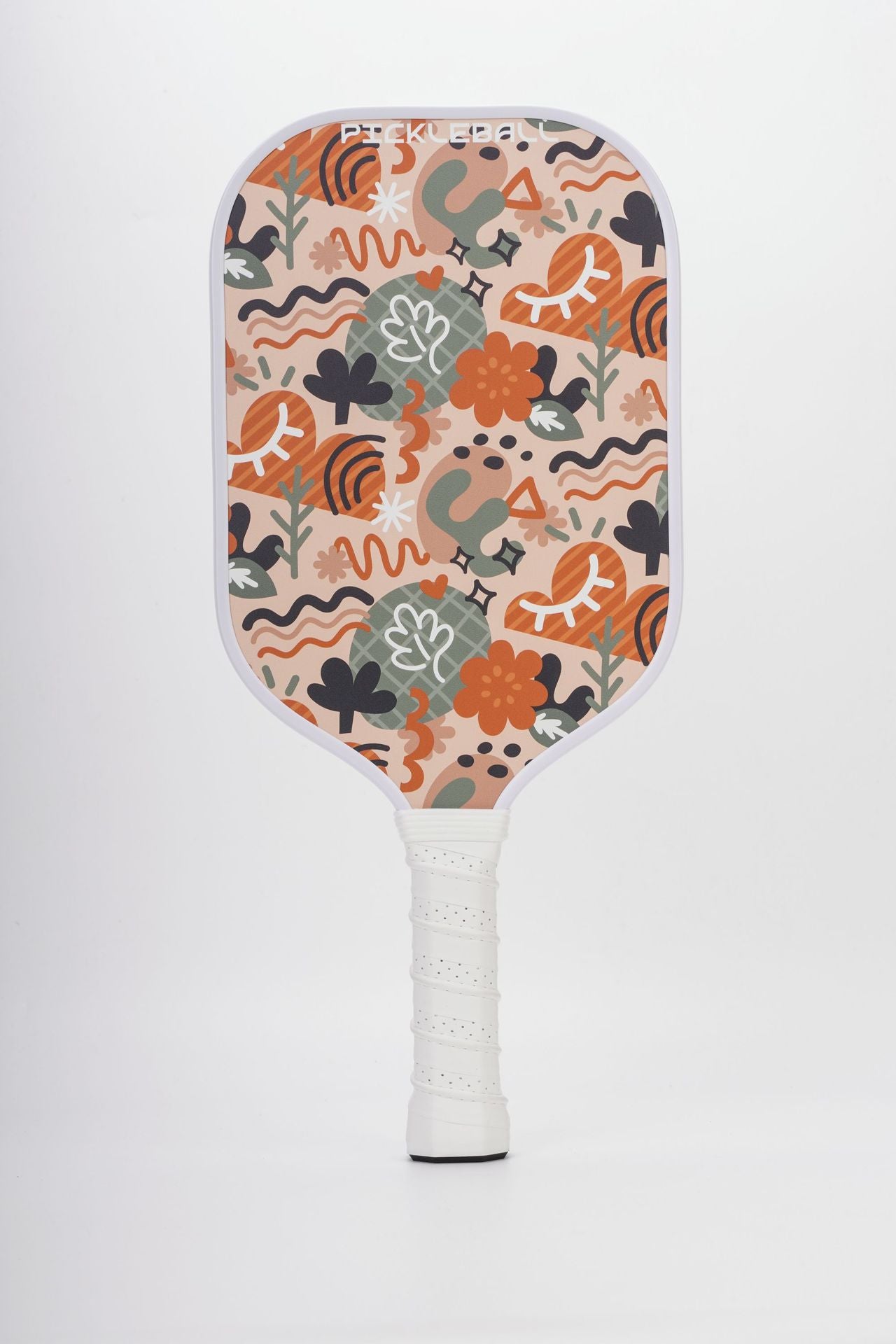 Close-up of the Xephira offensive fiberglass paddle featuring a complex pattern of cartoon animals and plants on a beige background. For those seeking unique design, this is what defines what are good pickleball paddles.