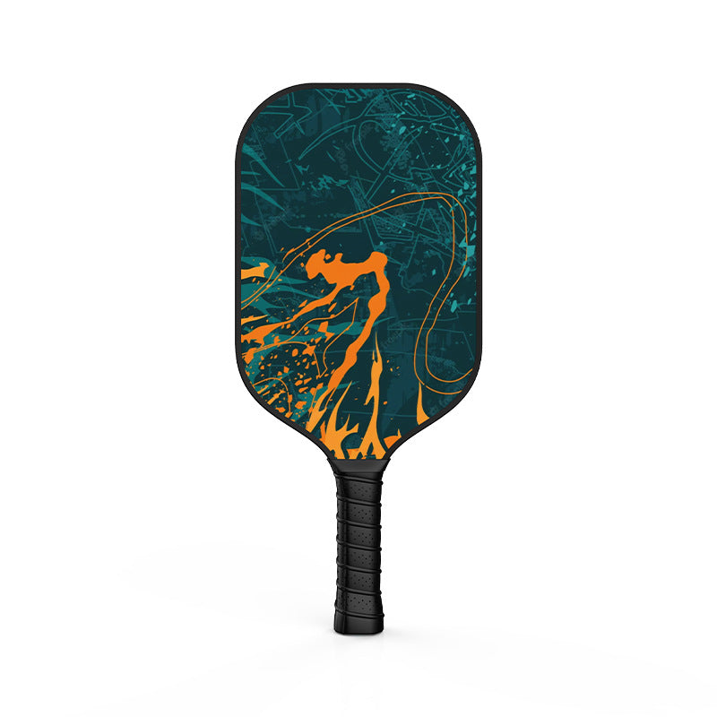 Close-up of the Xephira offensive fiberglass paddle featuring a bold orange and teal splatter abstract design. This is an example of what is a good pickleball paddle for players seeking power and unique aesthetics.