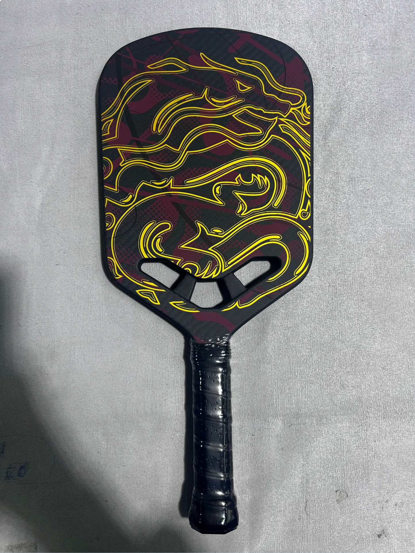 16mm bright yellow dragon pro paddle, a strong contender for what is the best pickleball paddle.