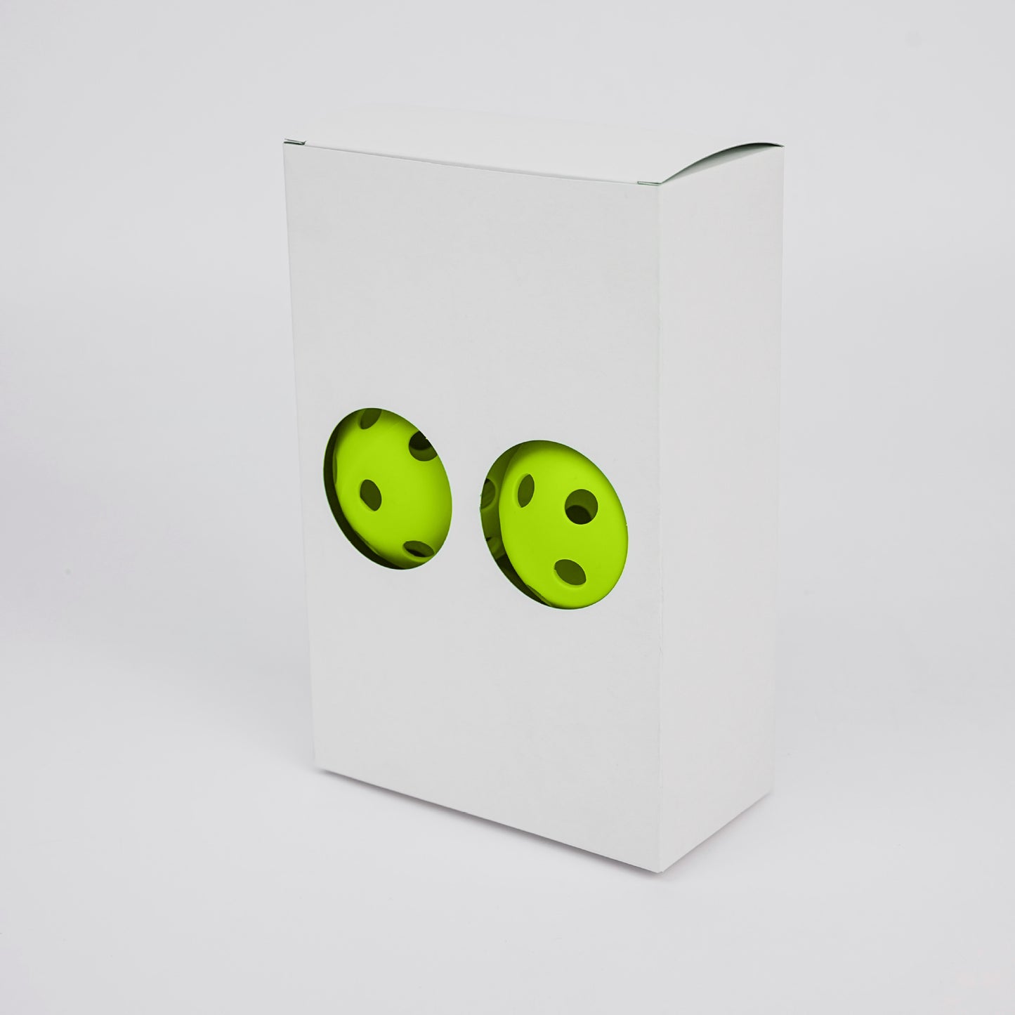 Green TPE 26-hole indoor pickleballs in a white 6-ball box. Which pickleball paddle to buy for indoor play.