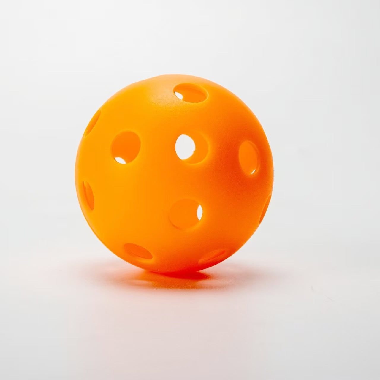 Vibrant Orange TPE 26-hole indoor pickleball. What is a good pickleball paddle for beginners.