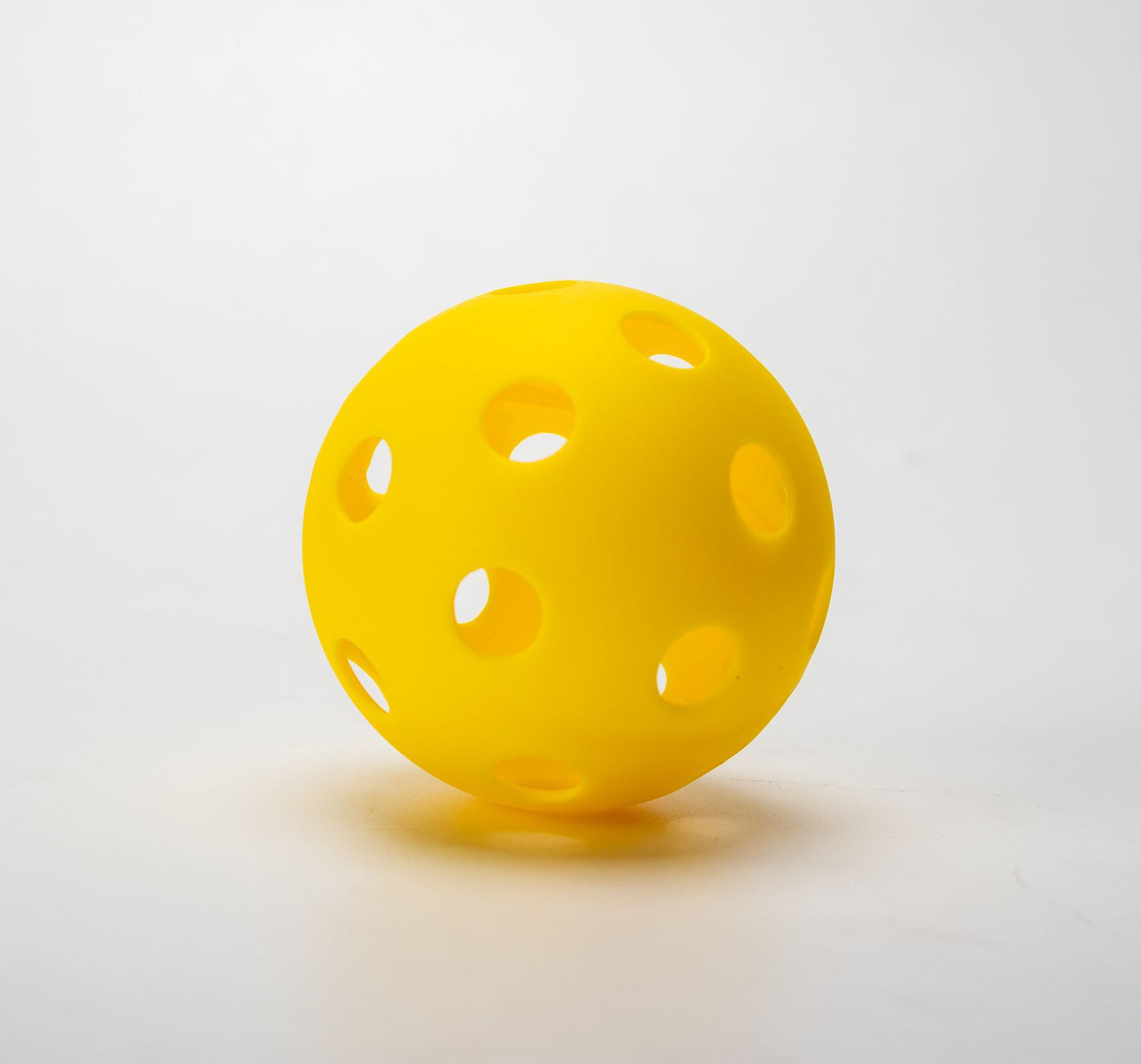 Optic Yellow TPE 26-hole indoor pickleball. Where to buy pickleball paddles for indoor play.