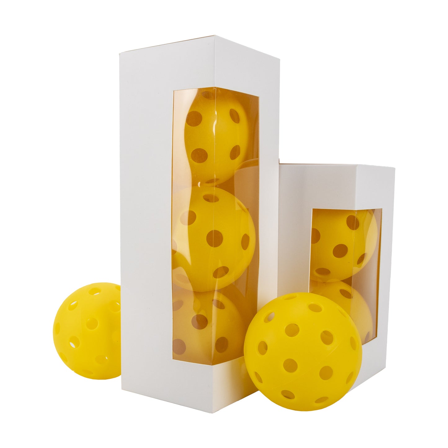 Multiple yellow pickleball boxes (tall and short) with balls displayed, emphasizing packaging options.