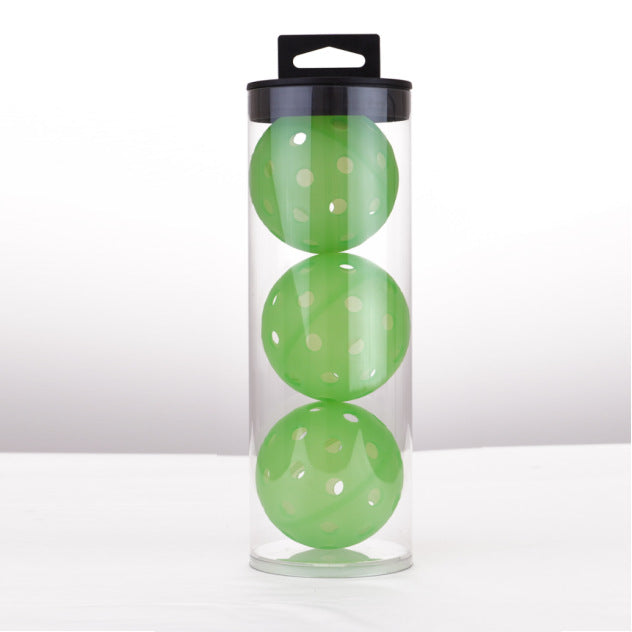 Three green 40-hole outdoor pickleballs in a clear tube, highlighting the vibrant color options.